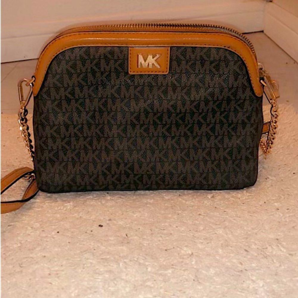 Lightly used medium brown crossbody Michael korrs purse from Dillard's